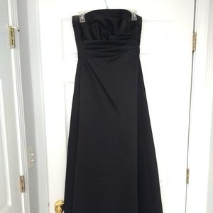 Black satin strapless gown.